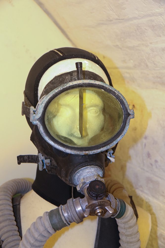 Mannequin wearing a diving mask which has a small internal rubber wiper
