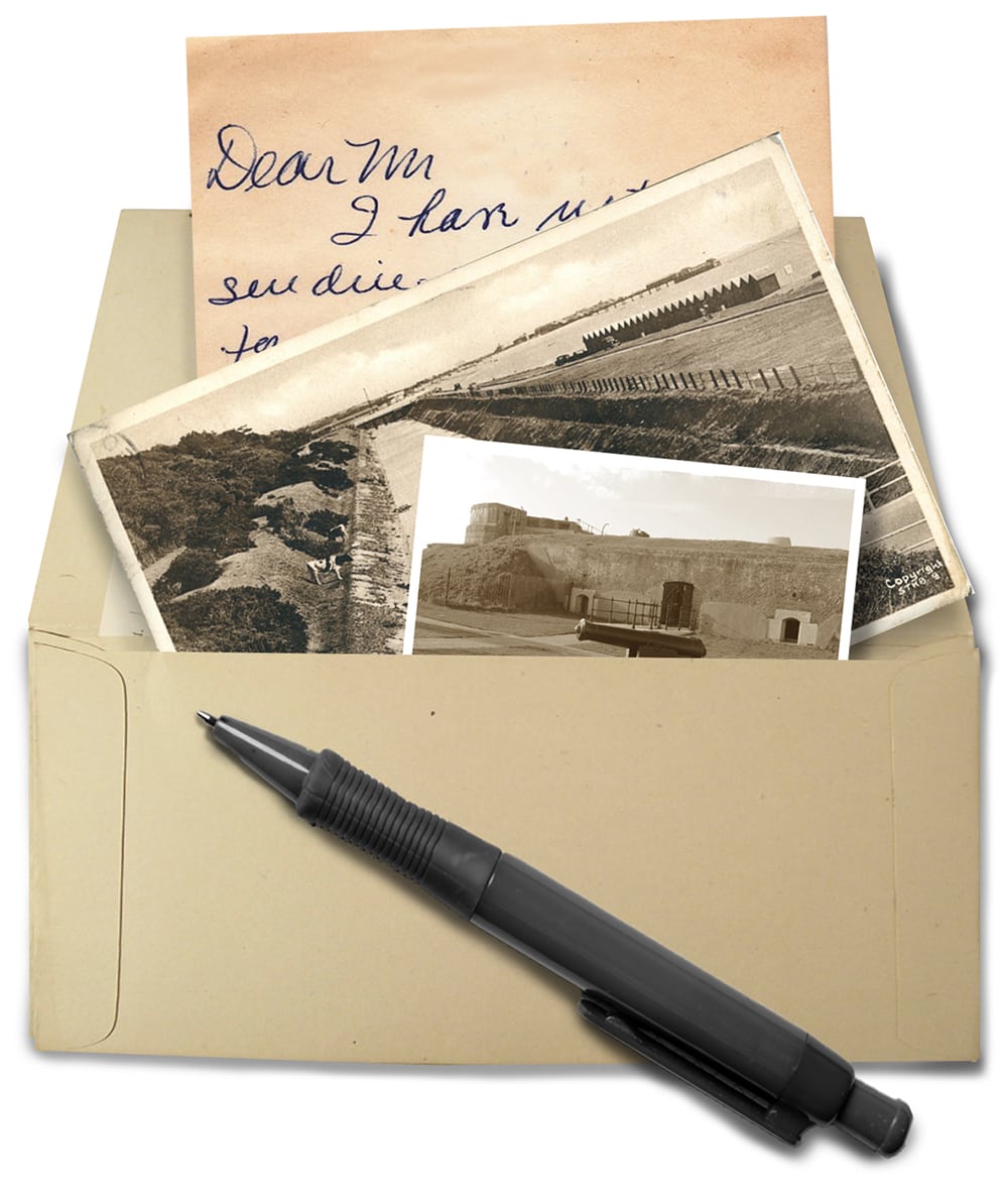 An open envelope with come sepia coloured photographs and letter spilling out. A pen lies on top of the envelope.