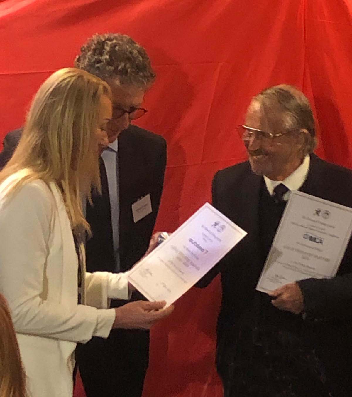 Liz James of Subsea7 receives a certificate from Dr John Bevan in recognition of Subsea7's support to the museum.