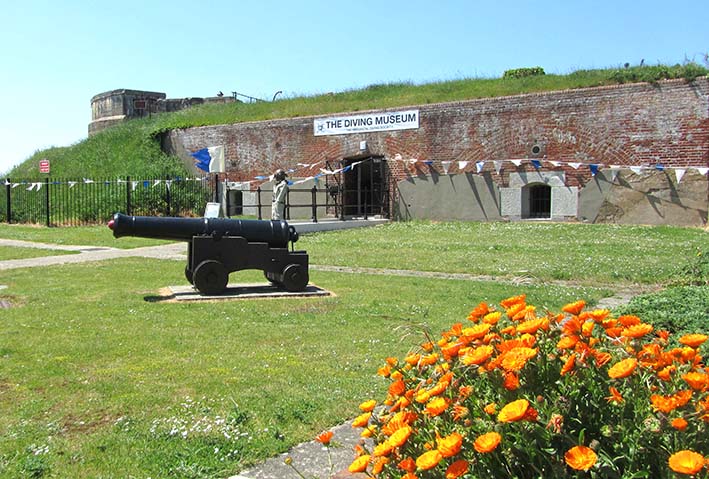 View of the outside of the museum with a cannon in the foreground