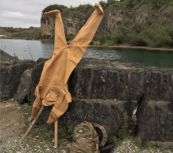 A Standard Dress drying upside down on an X-frame